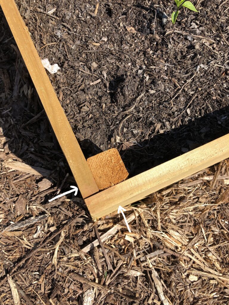 Two wood boards joining to make a corner.